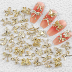 50pcs 3D Gold Bow Nail Charms Butterfly Nail Art Charms Legierung Bogen Nagel Charms Nägel Zubehör Schleife Nagelschmuck Metall Schleifen Schmetterling Nageldesign Nagelanhänger Nailart Strasssteine