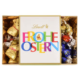 Nid de Pâques en chocolat Lindt coloré | 310g | 8 x mini lapins dorés, 26 x œufs en chocolat au lait Lindor, 15 x œufs en chocolat blanc Lindor, 10 x œufs en chocolat noir Lindor | Chocolat de Pâques | Cadeau de chocolat