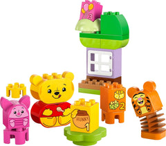 LEGO DUPLO - Disney Winnie l'ourson's Birthday Party - jouet éducatif pour les enfants d'âge préscolaire - set de 3 figurines dont Winnie l'ourson, Tigrou et Porcinet - idée cadeau pour garçons et filles à partir de 1 an et demi 10457 Beuche sets de construction dans le LEGO-Store