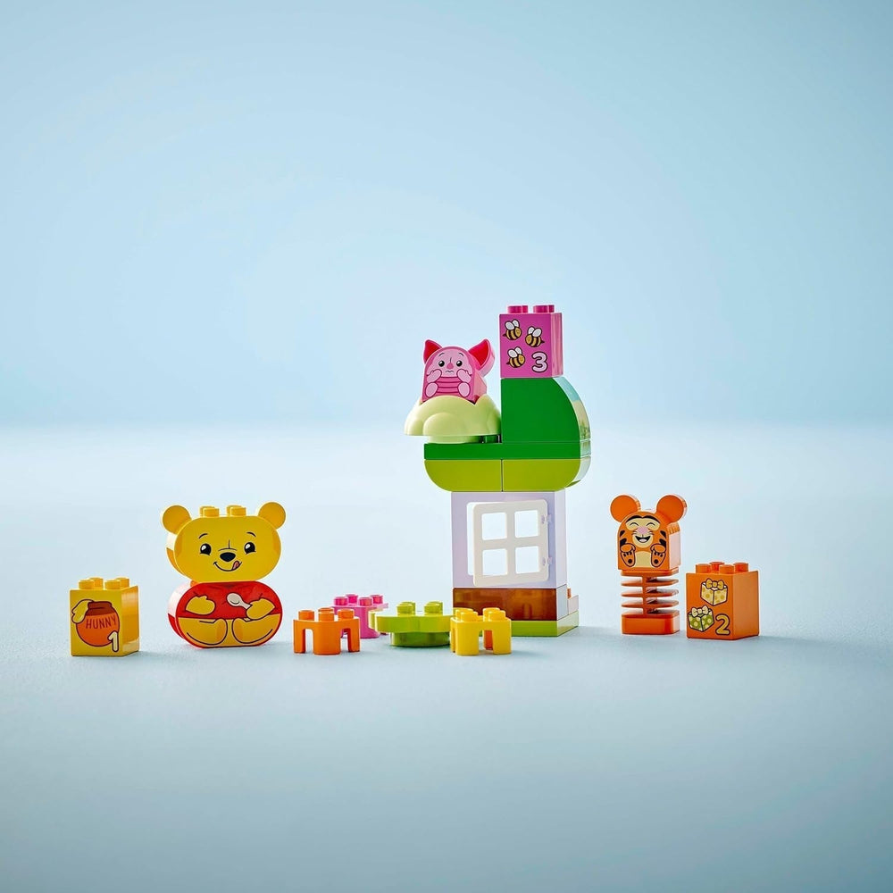 LEGO DUPLO - Disney Winnie l'ourson's Birthday Party - jouet éducatif pour les enfants d'âge préscolaire - set de 3 figurines dont Winnie l'ourson, Tigrou et Porcinet - idée cadeau pour garçons et filles à partir de 1 an et demi 10457 Beuche sets de construction dans le LEGO-Store