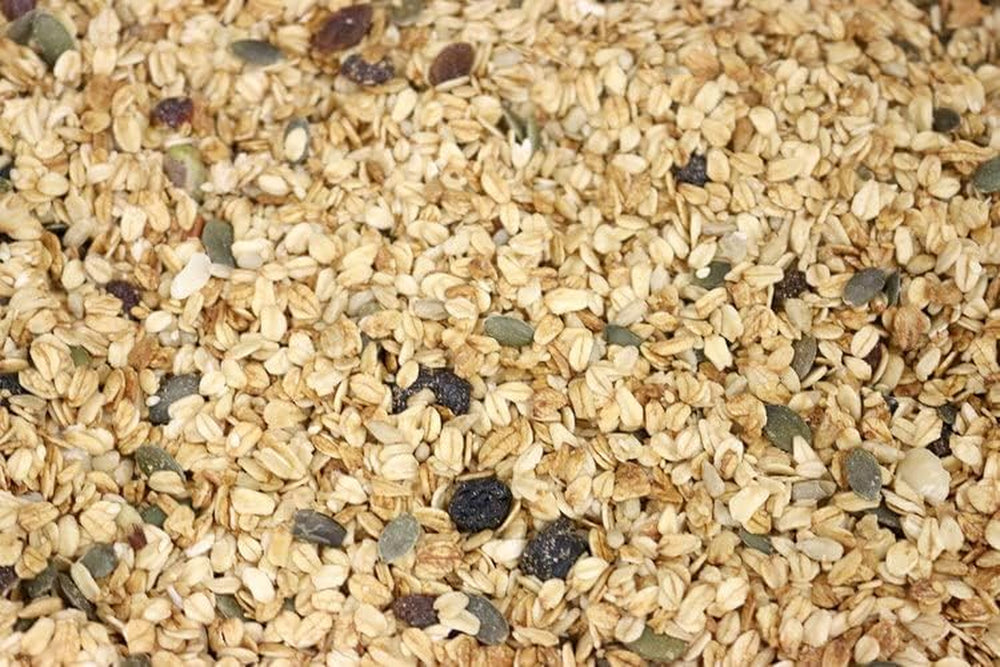 Muesli Deluxe Wholefood Earth - Un mélange de flocons avec des fruits secs, des noix et des graines 1 kg | Sans OGM | Riche en fibres