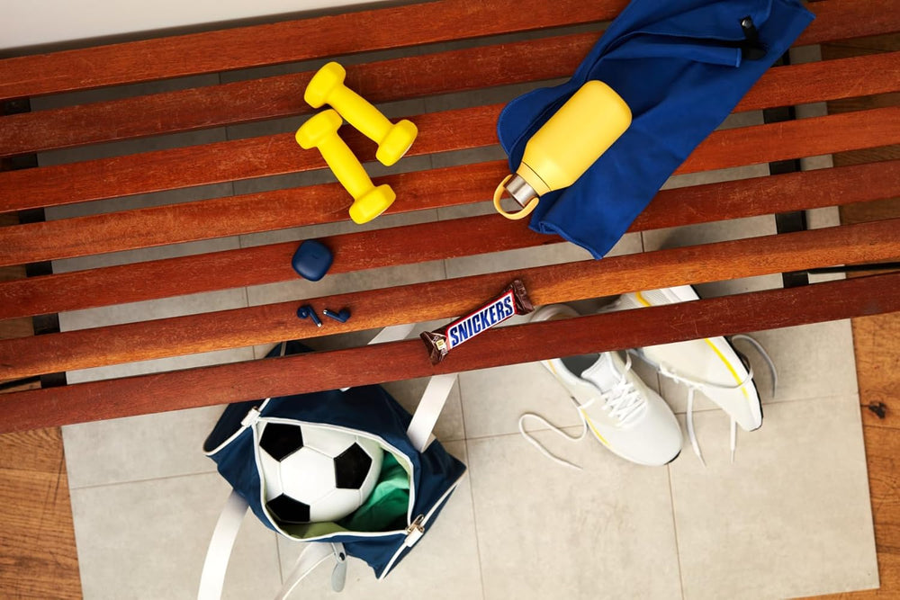 Un grand paquet de chocolat contenant 32 tablettes de chocolat de 50 g chacune.