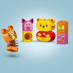 LEGO DUPLO - Disney Winnie l'ourson's Birthday Party - jouet éducatif pour les enfants d'âge préscolaire - set de 3 figurines dont Winnie l'ourson, Tigrou et Porcinet - idée cadeau pour garçons et filles à partir de 1 an et demi 10457 Beuche sets de construction dans le LEGO-Store