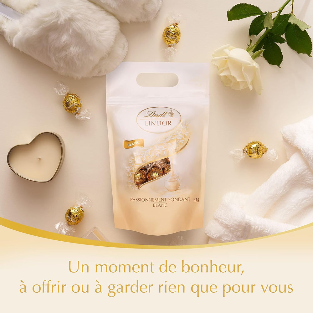 Boules de chocolat blanc LINDOR, 1 kg et LINDOR | Sac refermable de 1 kg | env. 80 boules de chocolat au lait fourrées à la menthe | Colis vrac, cadeau praliné, cadeau chocolat