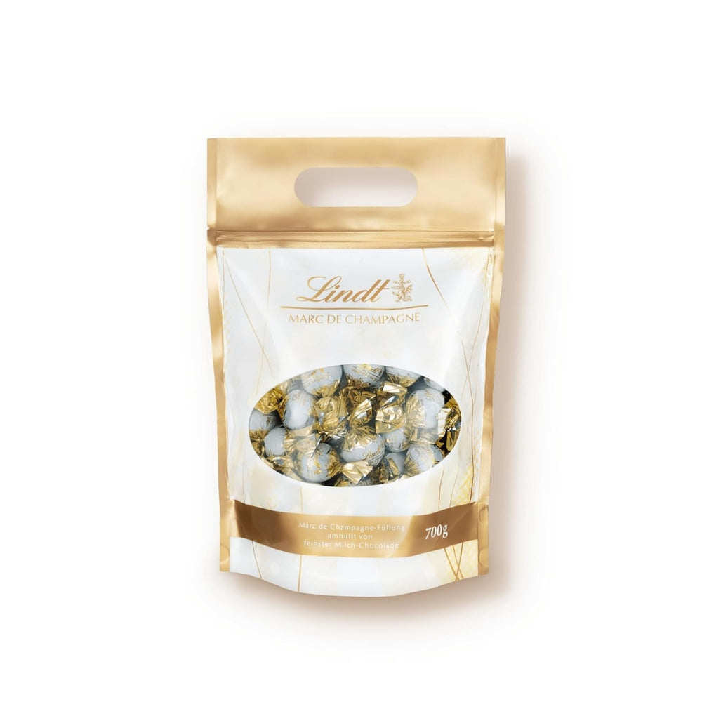 Lindt Marc De Champagne 56 chocolats au lait entier fourrés raffinés contenant de l'alcool 70 grammes Naty Shop Chocolates