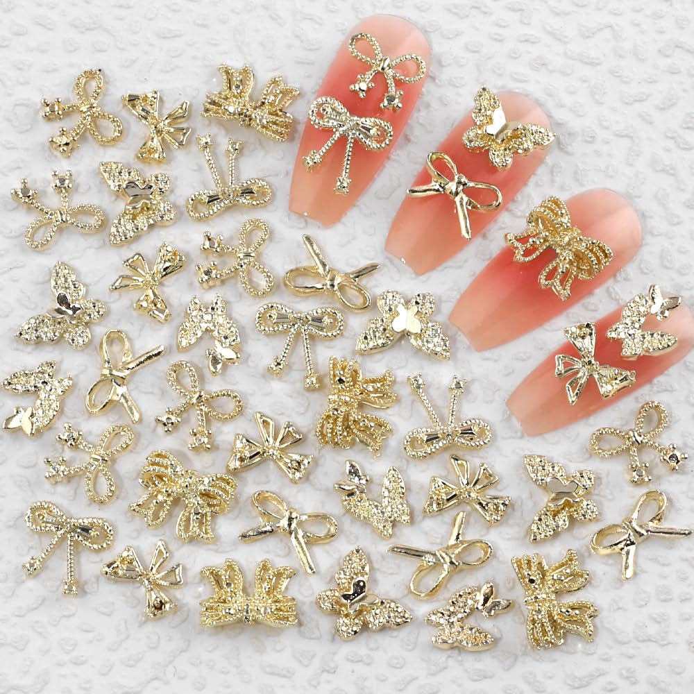 50pcs 3D Gold Bow Nail Charms Butterfly Nail Art Charms Legierung Bogen Nagel Charms Nägel Zubehör Schleife Nagelschmuck Metall Schleifen Schmetterling Nageldesign Nagelanhänger Nailart Strasssteine